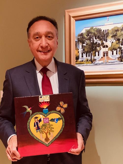 Henry Cisneros with Heart painting